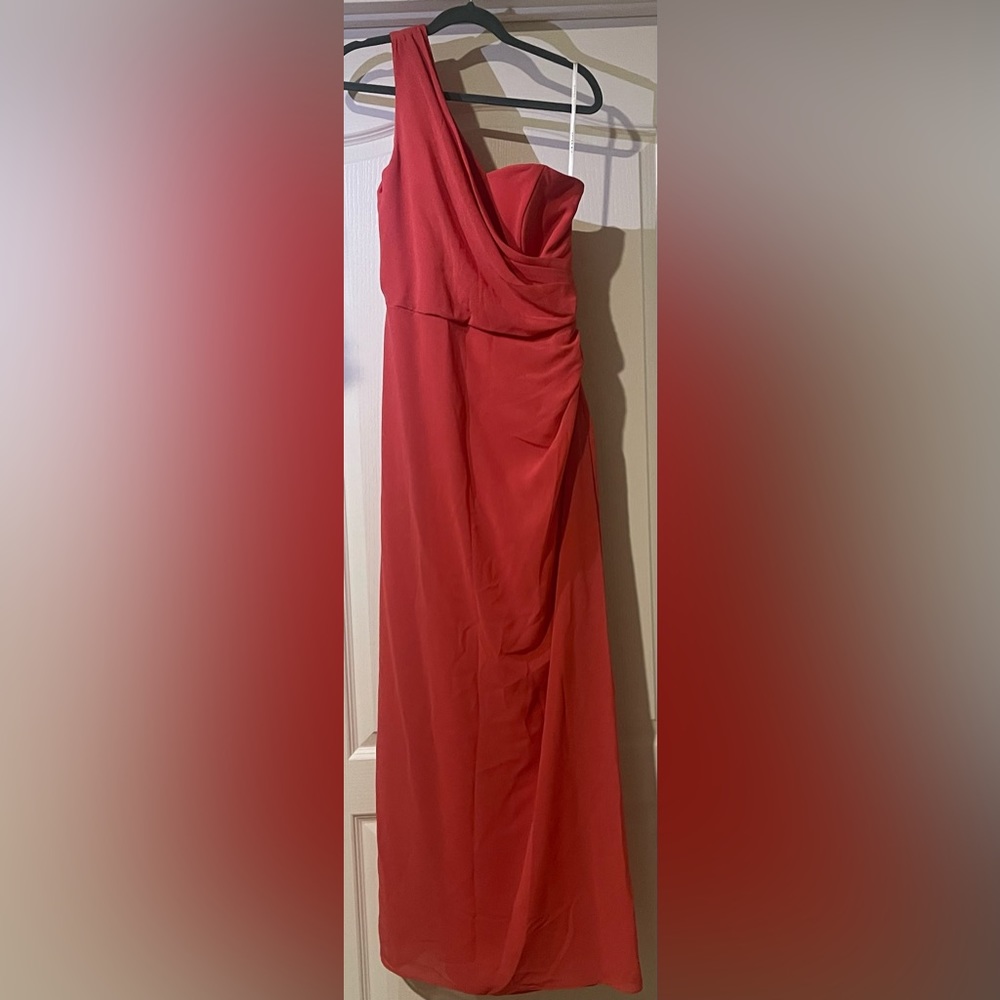 A Coralie red one shoulder dress.